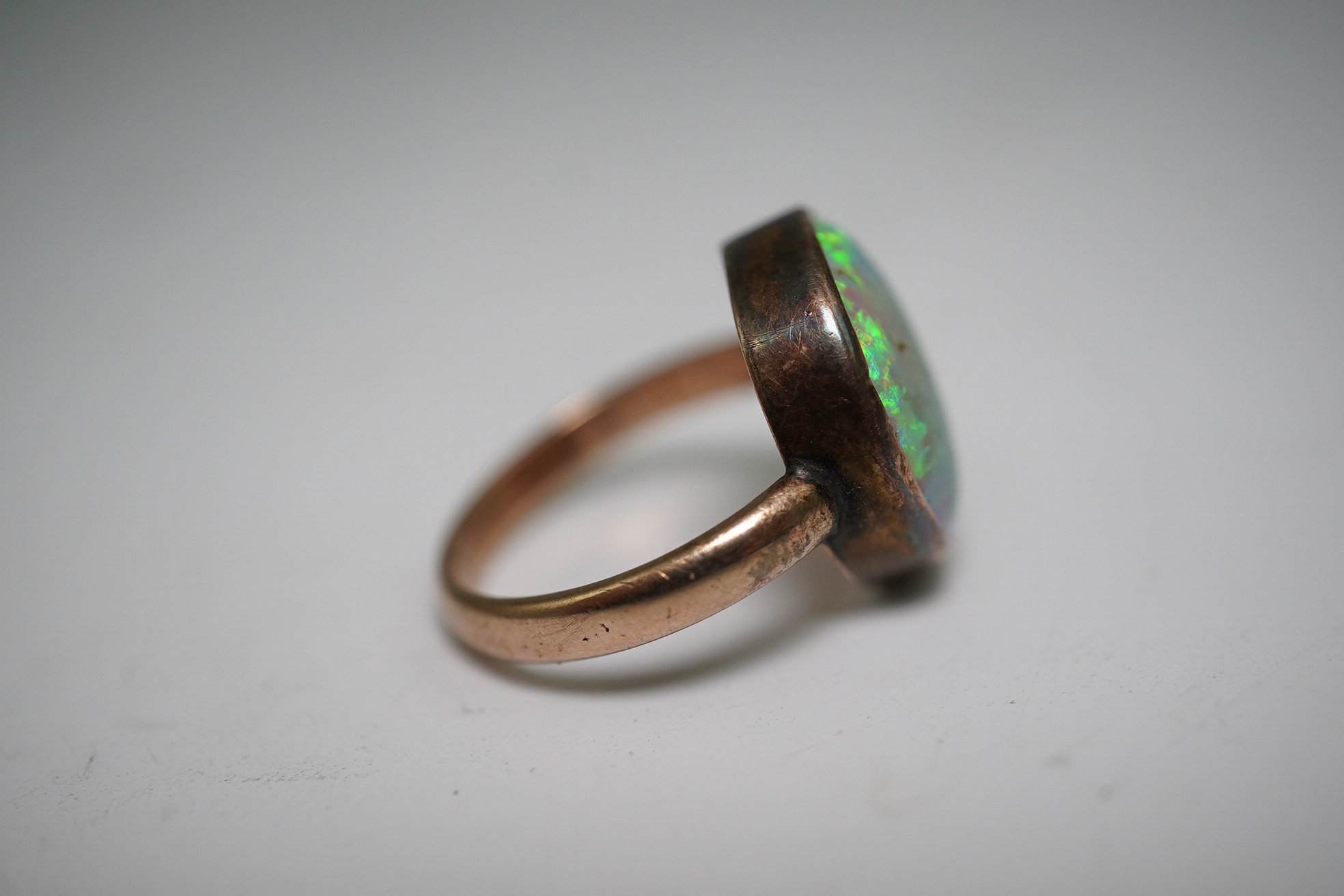 A 9ct gold opal dress ring, size J, gross weight 4.1 grams.